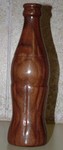 Wooden Coke bottle from lathe-turned walnut.